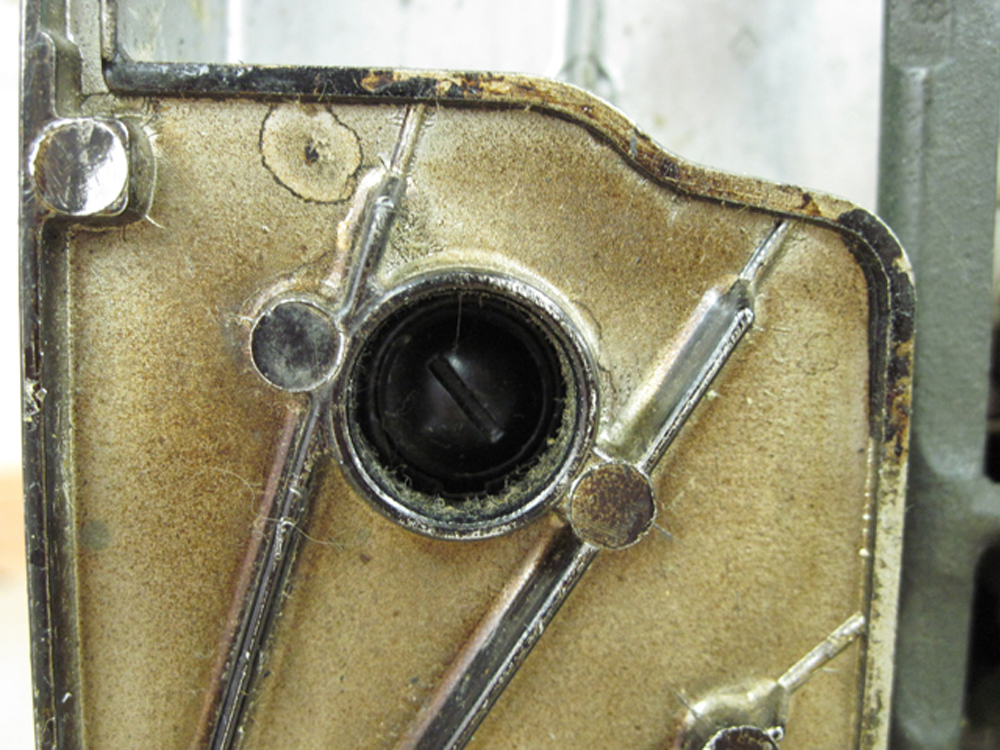 The motor brush access hole from the bottom of the machine.